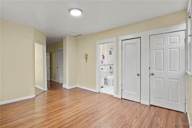 159 Kilhoffer St, Buffalo, NY 14211 - unfurnished bedroom with light wood-style flooring, baseboards, ensuite bath, and a closet