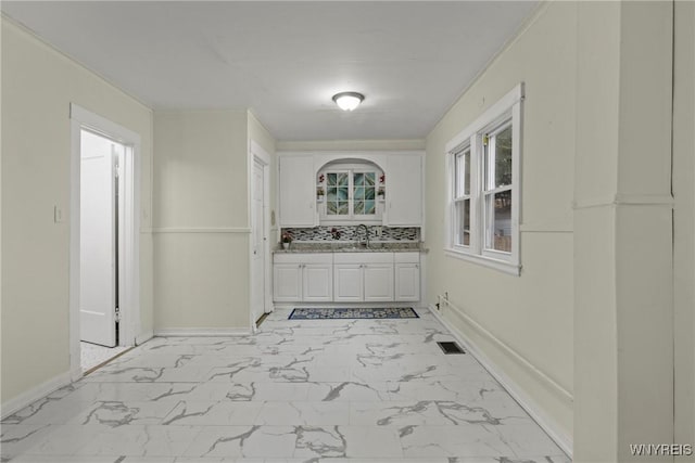 159 Kilhoffer St, Buffalo, NY 14211 - hallway featuring light marble finish flooring, baseboards, and a sink