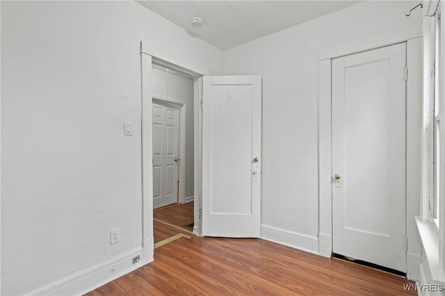159 Kilhoffer St, Buffalo, NY 14211 - unfurnished bedroom with wood finished floors, baseboards, and a closet