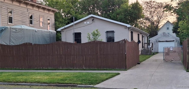 272 Dewitt St, Buffalo, NY 14213 - view of property exterior with an outdoor structure, a detached garage, and a gate