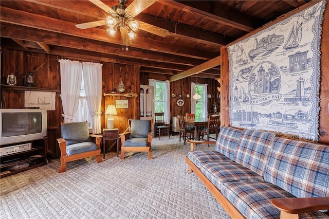 7732 Lake Blf, Huron, NY 14590 - carpeted living area with wooden ceiling with exposed beams, wood walls, and ceiling fan