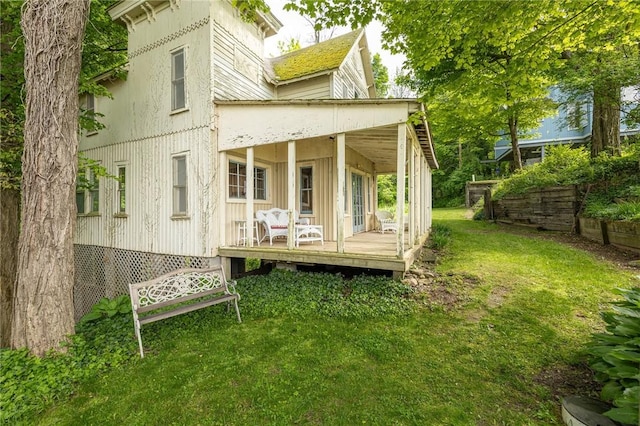 7732 Lake Blf, Huron, NY 14590 - rear view of house with a yard