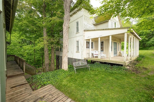 7732 Lake Blf, Huron, NY 14590 - rear view of house featuring a yard