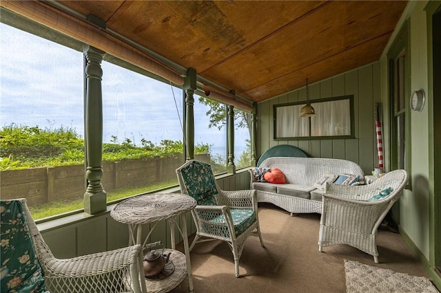 7732 Lake Blf, Huron, NY 14590 - sunroom with lofted ceiling, carpet, and outdoor lounge area