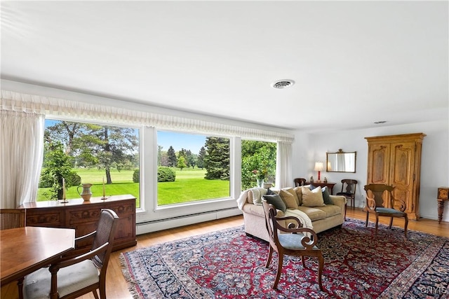 139 Capitol Street Ext, Sennett, NY 13021 - living area with baseboard heating and light wood-type flooring