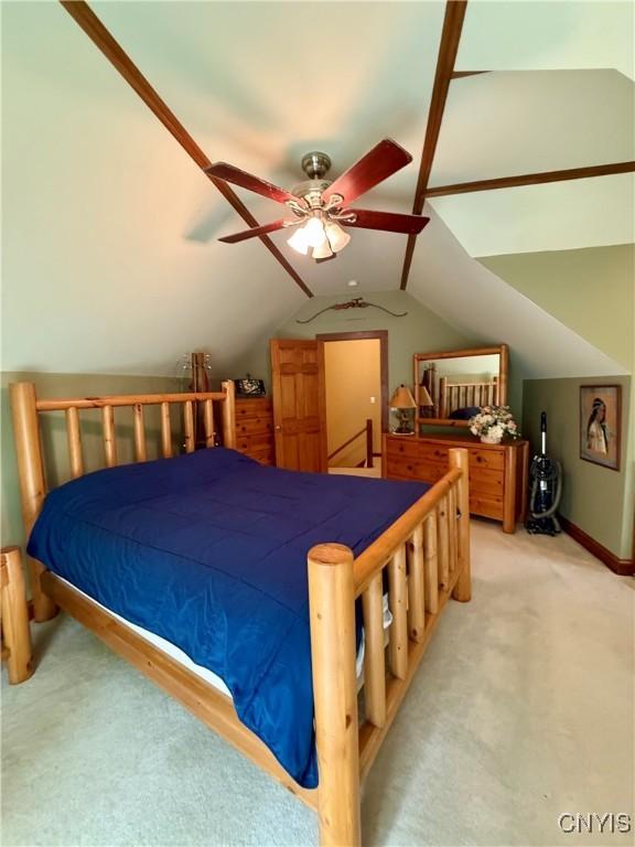 3805 State Highway 80, Columbus, NY 13460 - bedroom with light colored carpet, lofted ceiling, and ceiling fan