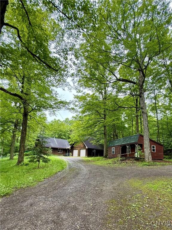 3805 State Highway 80, Columbus, NY 13460 - view of front of house with gravel driveway and an outdoor structure