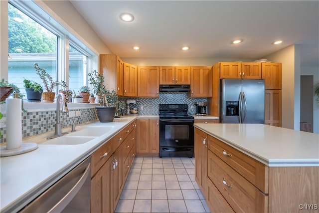 3871 Skyline Dr, Kirkland, NY 13323 - kitchen featuring appliances with stainless steel finishes, under cabinet range hood, a sink, decorative backsplash, and recessed lighting