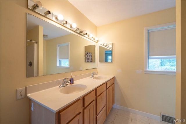 3871 Skyline Dr, Kirkland, NY 13323 - full bath with double vanity, healthy amount of natural light, tile patterned flooring, and baseboards
