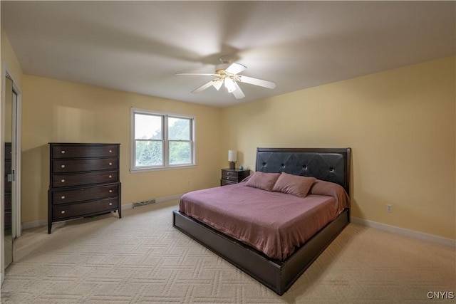 3871 Skyline Dr, Kirkland, NY 13323 - bedroom with light colored carpet, baseboards, and a ceiling fan