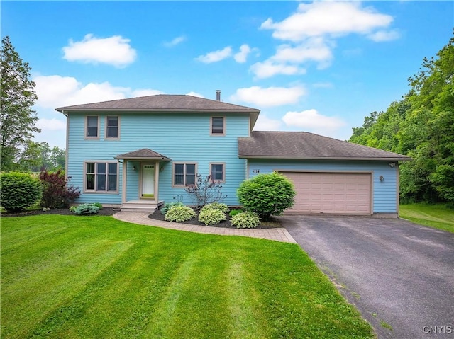 3871 Skyline Dr, Kirkland, NY 13323 - view of front of home featuring asphalt driveway, an attached garage, and a front lawn