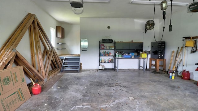 1547 Great Gully Rd, Springport, NY 13160 - garage featuring a garage door opener and a workshop area