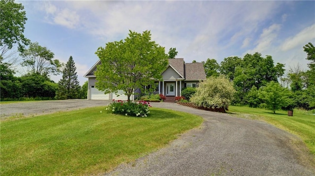 1547 Great Gully Rd, Springport, NY 13160 - view of front of house with asphalt driveway, a front lawn, and an attached garage