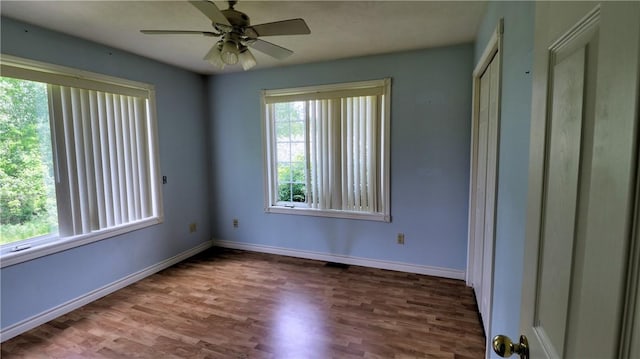 1547 Great Gully Rd, Springport, NY 13160 - unfurnished bedroom featuring wood finished floors, baseboards, and a ceiling fan