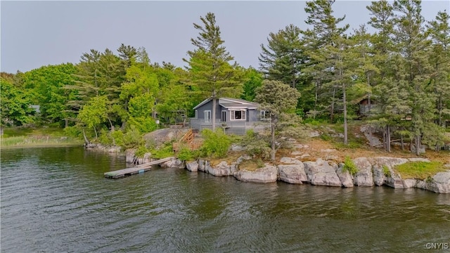 48785 Bamerick Rd, Alexandria, NY 13679 - dock featuring stairs, a view of trees, and a deck with water view
