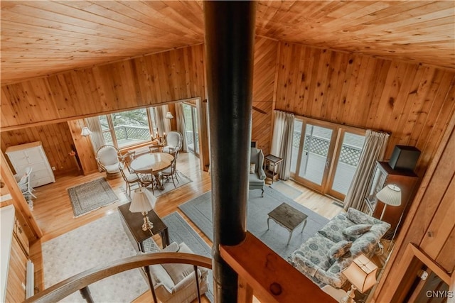 48785 Bamerick Rd, Alexandria, NY 13679 - living room featuring wood ceiling, a wood stove, wood walls, and wood finished floors