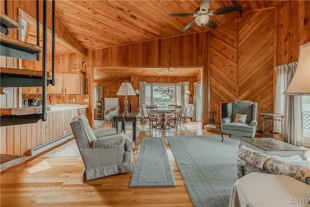 48785 Bamerick Rd, Alexandria, NY 13679 - living room with lofted ceiling, wood walls, ceiling fan, wood ceiling, and light wood-style flooring