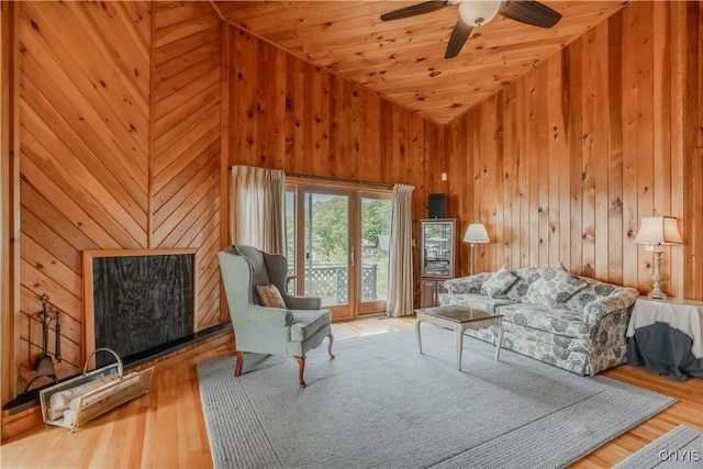 48785 Bamerick Rd, Alexandria, NY 13679 - living area with wood walls, wood finished floors, a ceiling fan, wood ceiling, and vaulted ceiling