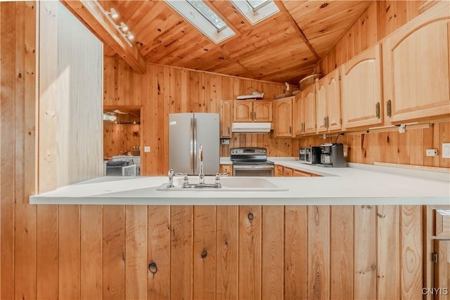 48785 Bamerick Rd, Alexandria, NY 13679 - kitchen featuring electric stove, freestanding refrigerator, under cabinet range hood, a skylight, and a peninsula