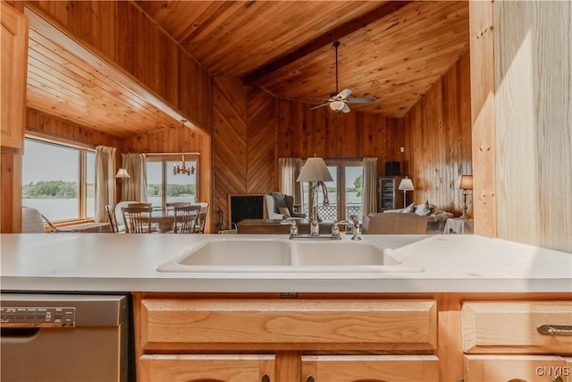 48785 Bamerick Rd, Alexandria, NY 13679 - kitchen featuring stainless steel dishwasher, open floor plan, wooden ceiling, a sink, and wood walls