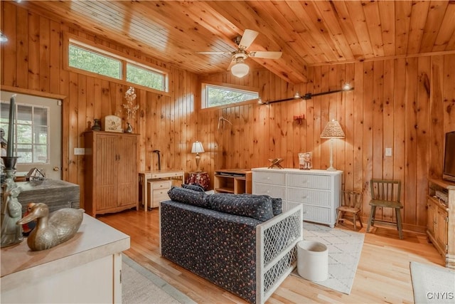 48785 Bamerick Rd, Alexandria, NY 13679 - living room featuring wooden walls, plenty of natural light, wooden ceiling, light wood-style floors, and vaulted ceiling