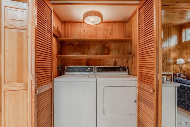 48785 Bamerick Rd, Alexandria, NY 13679 - washroom featuring wooden walls and washer and clothes dryer