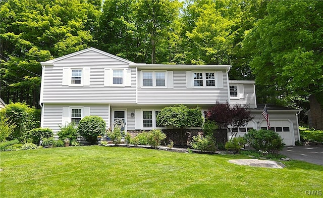 4648 Glencliffe Rd, Manlius, NY 13104 - view of front of property featuring a garage, asphalt driveway, and a front lawn