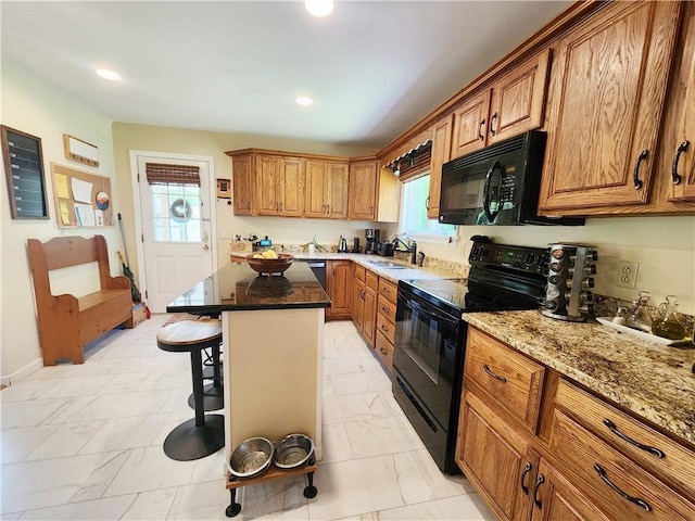 1305 Wyncoop Creek Rd, Chemung, NY 14825 - kitchen with black appliances, a sink, a breakfast bar area, brown cabinets, and light marble finish floors