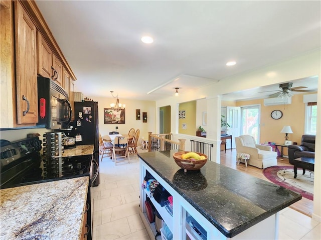 1305 Wyncoop Creek Rd, Chemung, NY 14825 - kitchen featuring black appliances, brown cabinetry, open floor plan, dark stone countertops, and a kitchen island