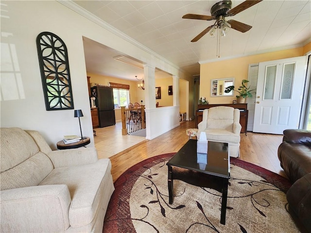 1305 Wyncoop Creek Rd, Chemung, NY 14825 - living area featuring crown molding, light wood-type flooring, decorative columns, and a ceiling fan