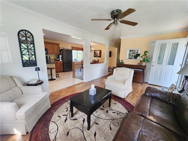 1305 Wyncoop Creek Rd, Chemung, NY 14825 - living room with light wood-type flooring, a ceiling fan, ornate columns, and ornamental molding