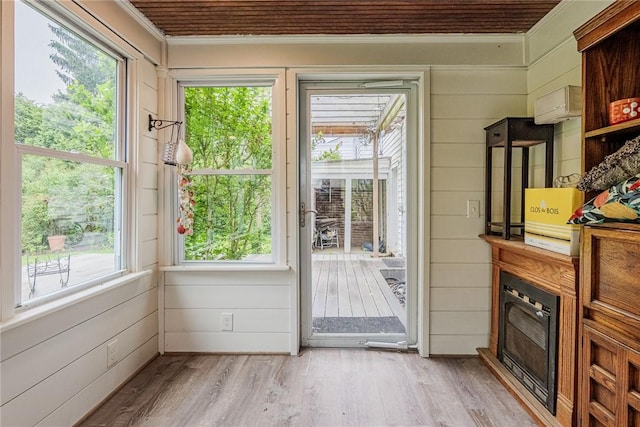 68 Colonial Village Rd, Brighton, NY 14625 - entryway with ornamental molding, healthy amount of natural light, light wood finished floors, and wood walls
