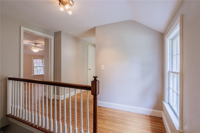 68 Colonial Village Rd, Brighton, NY 14625 - hall featuring light wood-style floors, baseboards, an upstairs landing, and vaulted ceiling