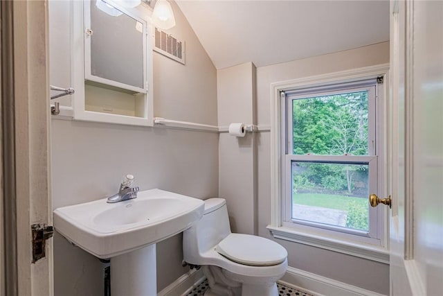 68 Colonial Village Rd, Brighton, NY 14625 - bathroom featuring toilet, lofted ceiling, and baseboards