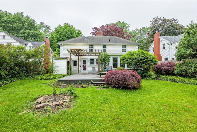 68 Colonial Village Rd, Brighton, NY 14625 - rear view of property with a pergola, a wooden deck, a lawn, and a chimney