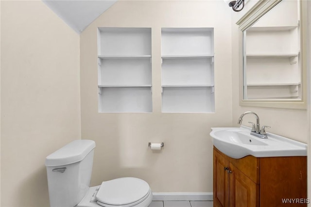 103 Ledger St, Buffalo, NY 14216 - half bathroom featuring toilet, vanity, tile patterned floors, and built in features