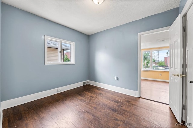 103 Ledger St, Buffalo, NY 14216 - unfurnished room featuring wood finished floors, baseboards, and a textured ceiling