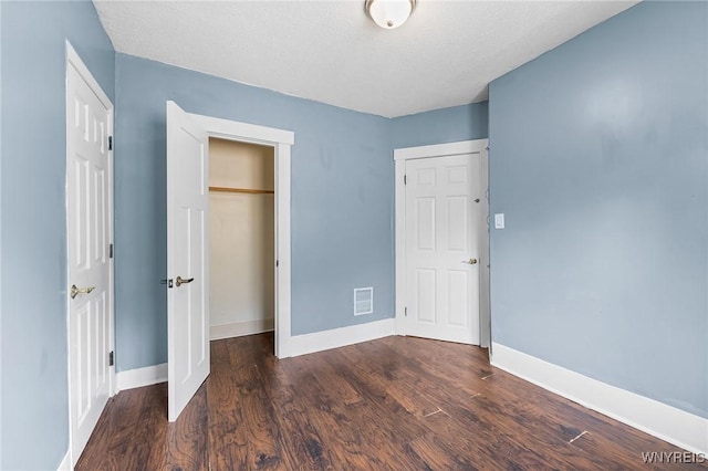 103 Ledger St, Buffalo, NY 14216 - unfurnished bedroom with wood finished floors, baseboards, a closet, and a textured ceiling