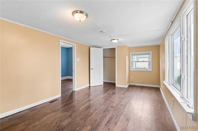 103 Ledger St, Buffalo, NY 14216 - unfurnished bedroom with dark wood-style floors, baseboards, a closet, and crown molding