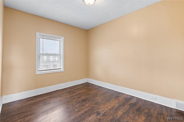 103 Ledger St, Buffalo, NY 14216 - unfurnished room with dark wood-type flooring and baseboards