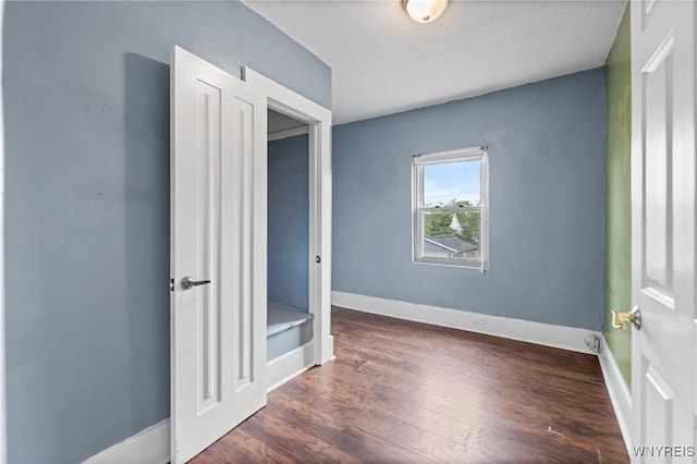 103 Ledger St, Buffalo, NY 14216 - unfurnished bedroom with wood finished floors and baseboards