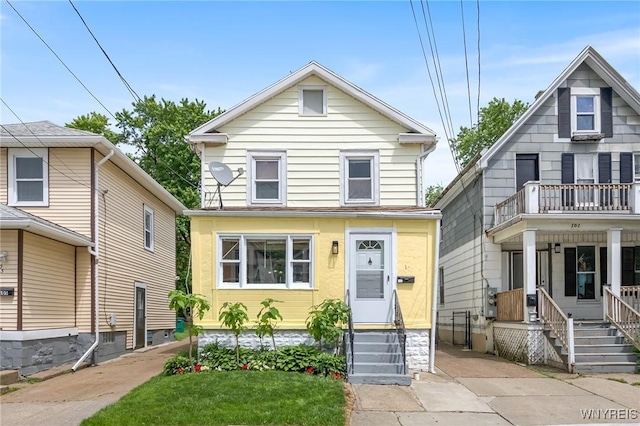 103 Ledger St, Buffalo, NY 14216 - american foursquare style home with a balcony and entry steps