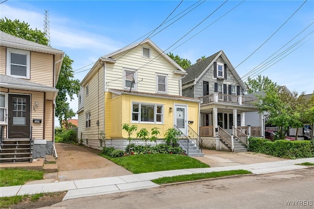103 Ledger St, Buffalo, NY 14216 - view of front of home with a balcony, entry steps, and covered porch