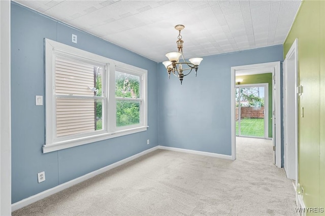 103 Ledger St, Buffalo, NY 14216 - spare room with a chandelier, carpet flooring, and baseboards