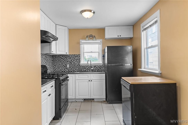 103 Ledger St, Buffalo, NY 14216 - kitchen with black appliances, under cabinet range hood, healthy amount of natural light, and white cabinetry
