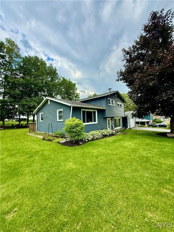 2718 Forest Hill Dr, Fleming, NY 13021 - back of property featuring a garage and a yard