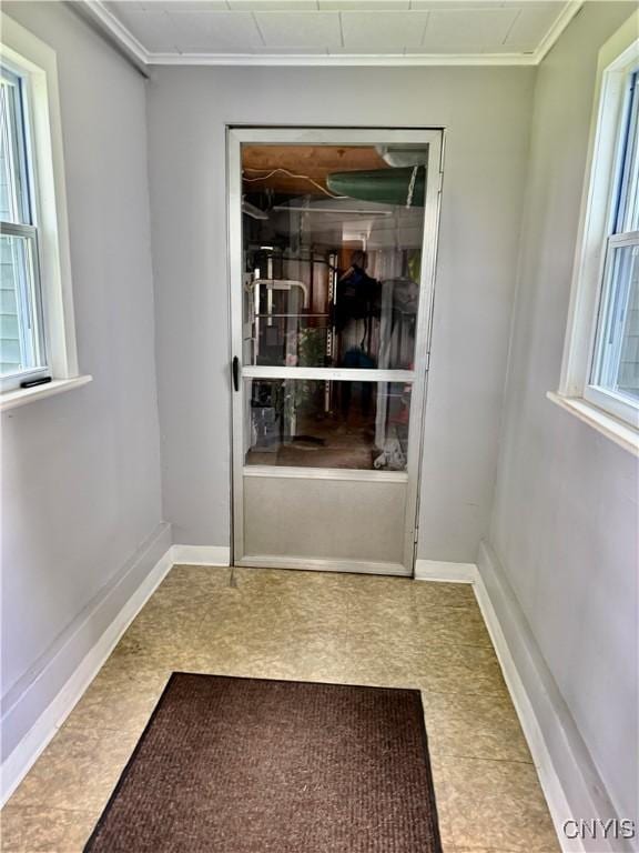 2718 Forest Hill Dr, Fleming, NY 13021 - doorway featuring crown molding, baseboards, and tile patterned floors