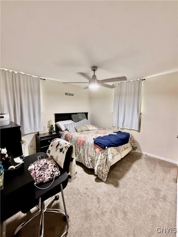 2718 Forest Hill Dr, Fleming, NY 13021 - bedroom with carpet floors, ceiling fan, and baseboards