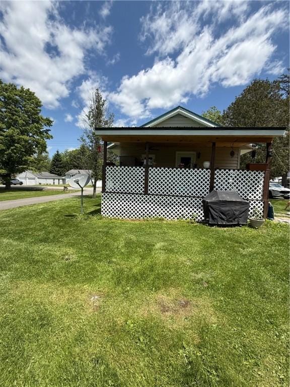 3679 County Highway 35, Middlefield, NY 13450 - view of side of home with a lawn