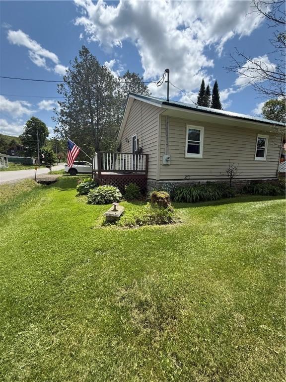 3679 County Highway 35, Middlefield, NY 13450 - view of side of property with a yard and a deck